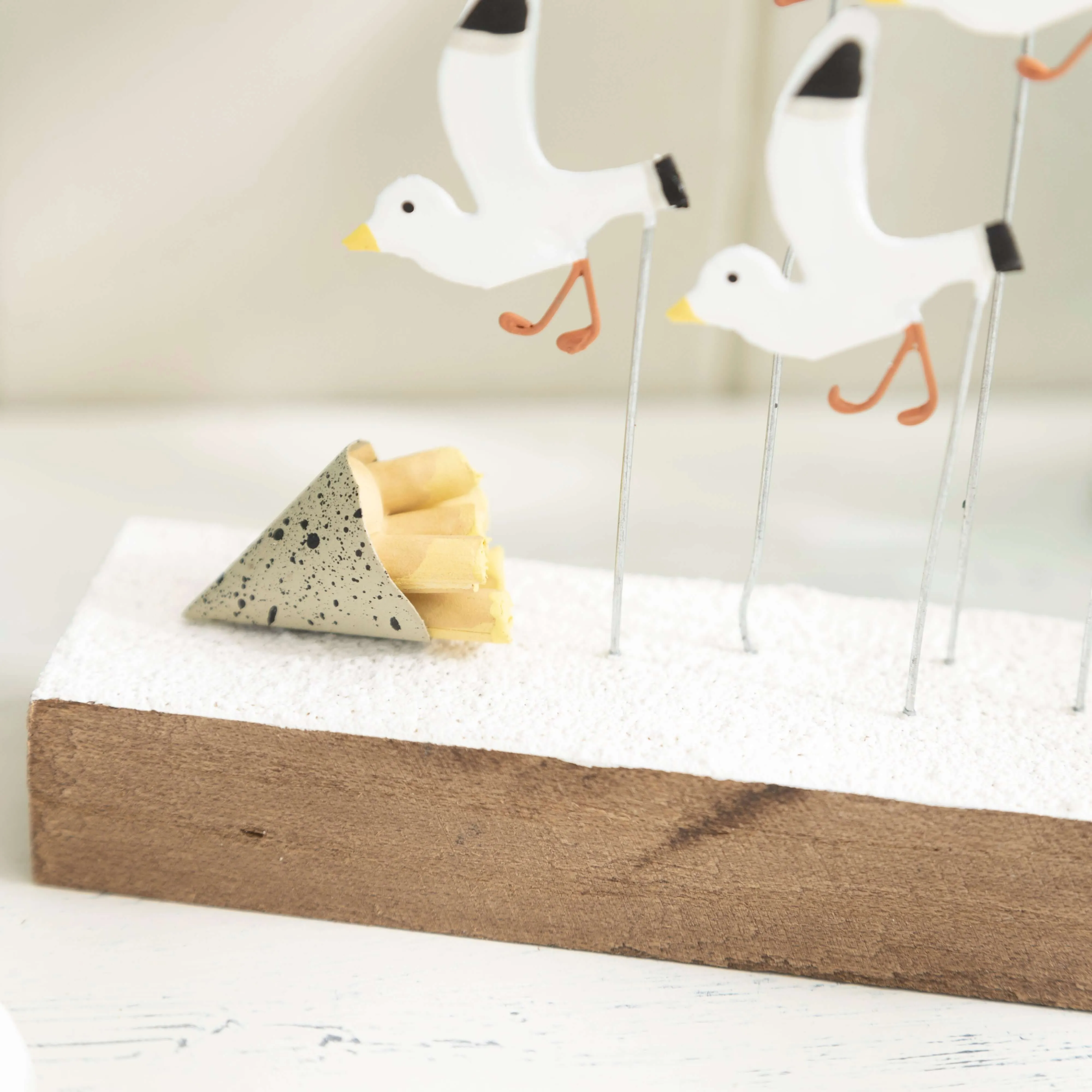 Flock of Seagulls Swooping for Chips – Coastal-Inspired Figurine Display